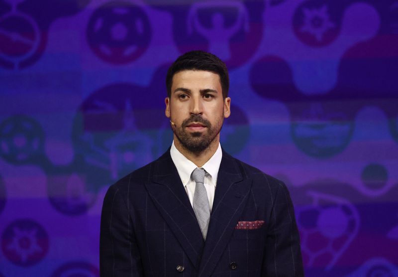 Two Flags, One Heart: Khedira Embraces Brothers Divided at World Cup