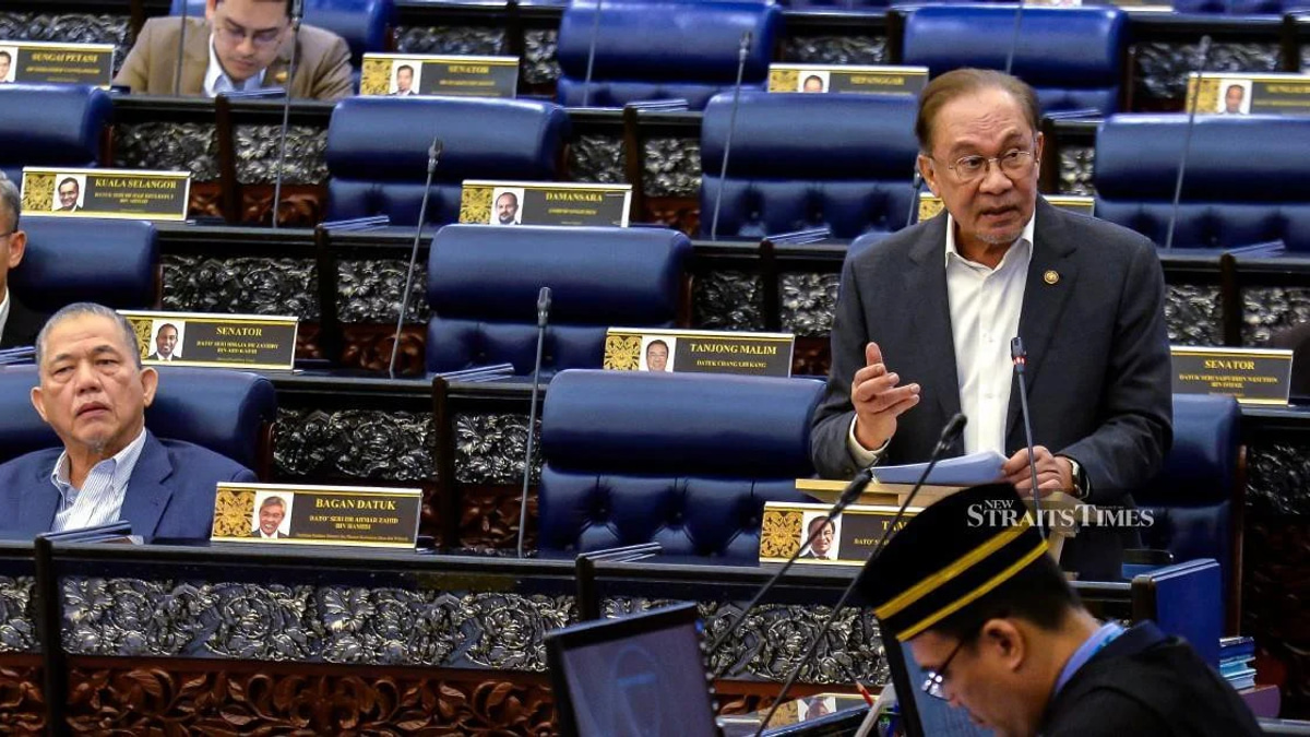 E-wallet firms face mandatory compensation rules for fraud failures, Anwar says