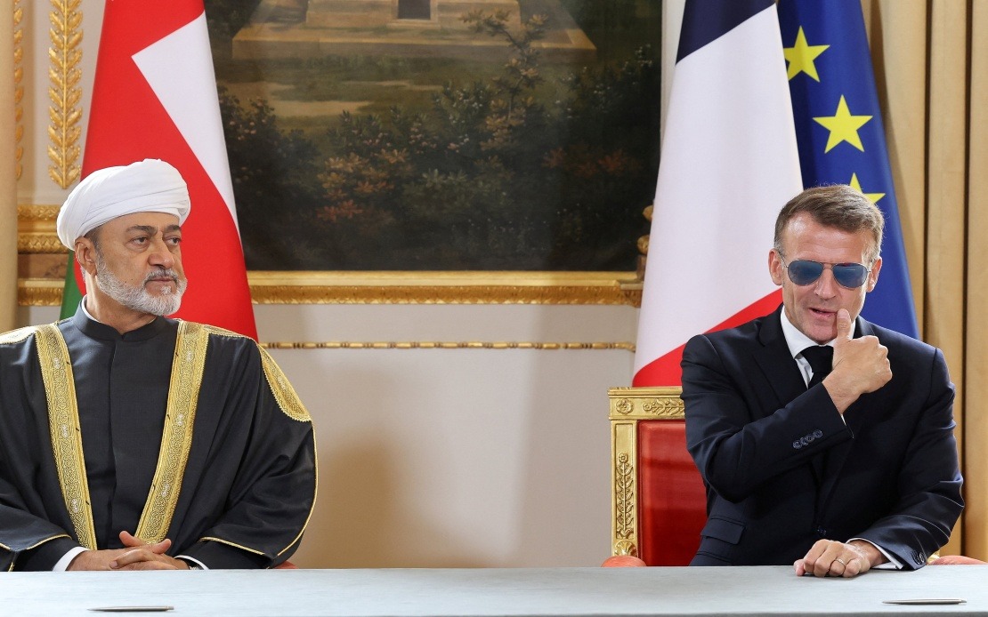 Macron's Aviators Return: French President Dons Sunglasses for Oman Sultan Meeting