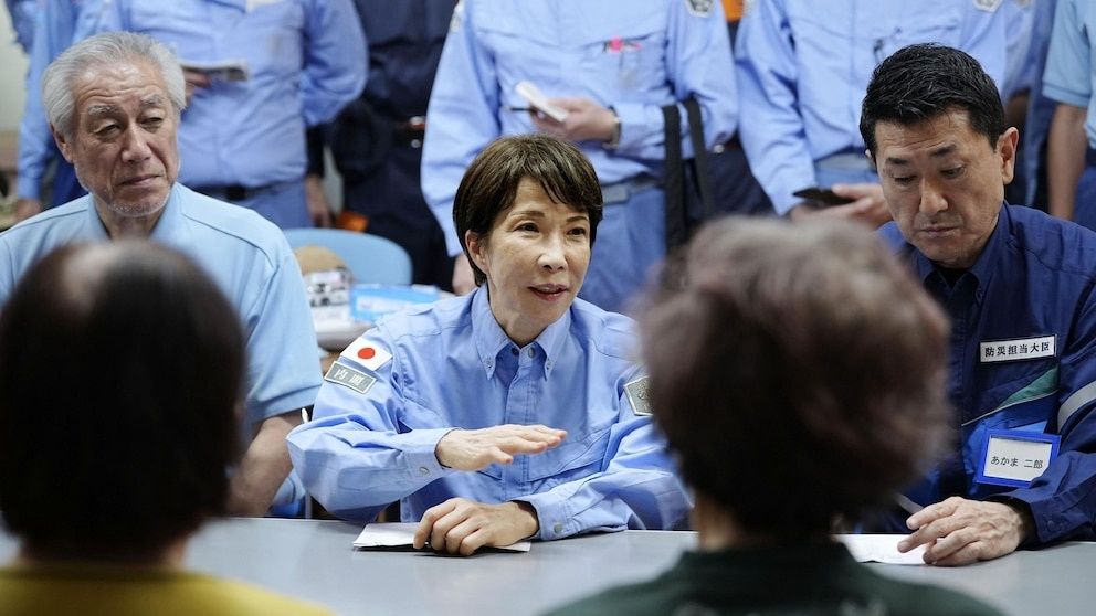Japan's PM visits quake-devastated Kumamoto as heat and shortages compound misery