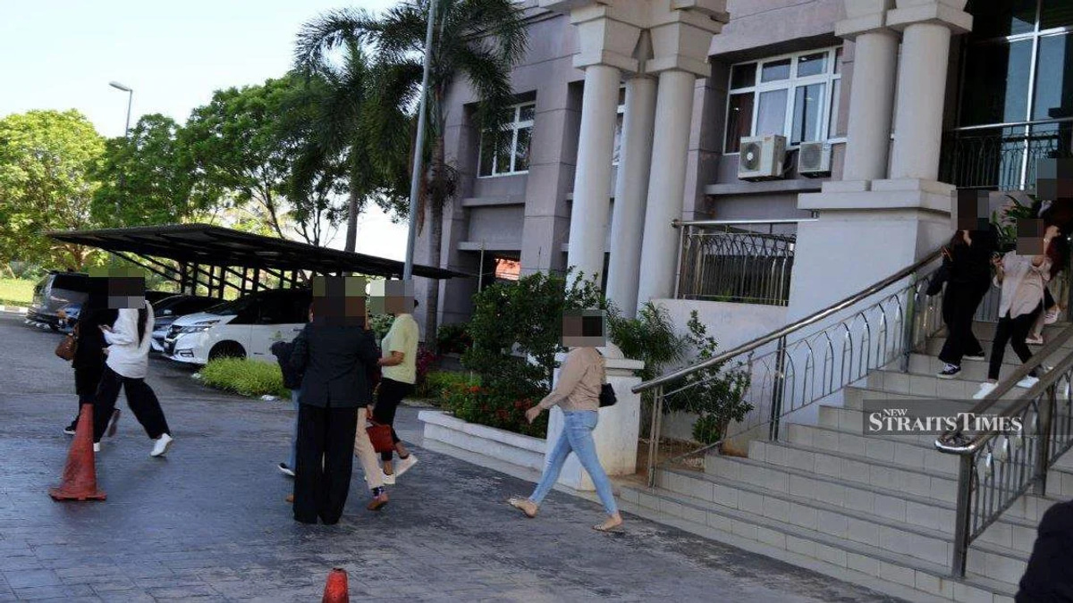 Kelantan Syariah Court Delays Trial of 14 Men Accused of Cross-Dressing