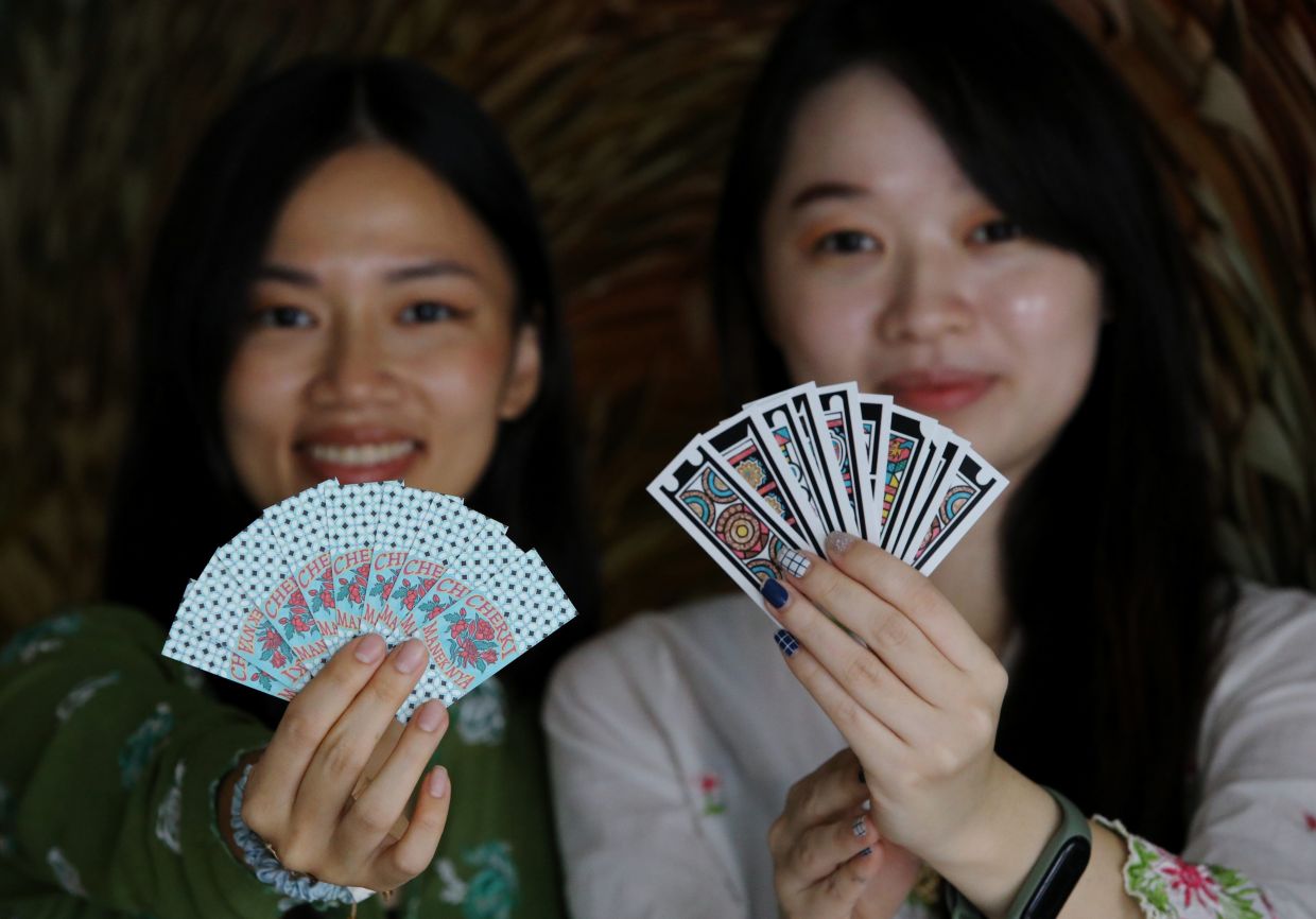 Sisters breathe new life into Cherki, a fading Peranakan card game