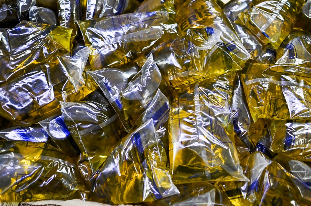 Six men charged over illegal stockpiling of subsidised cooking oil worth millions